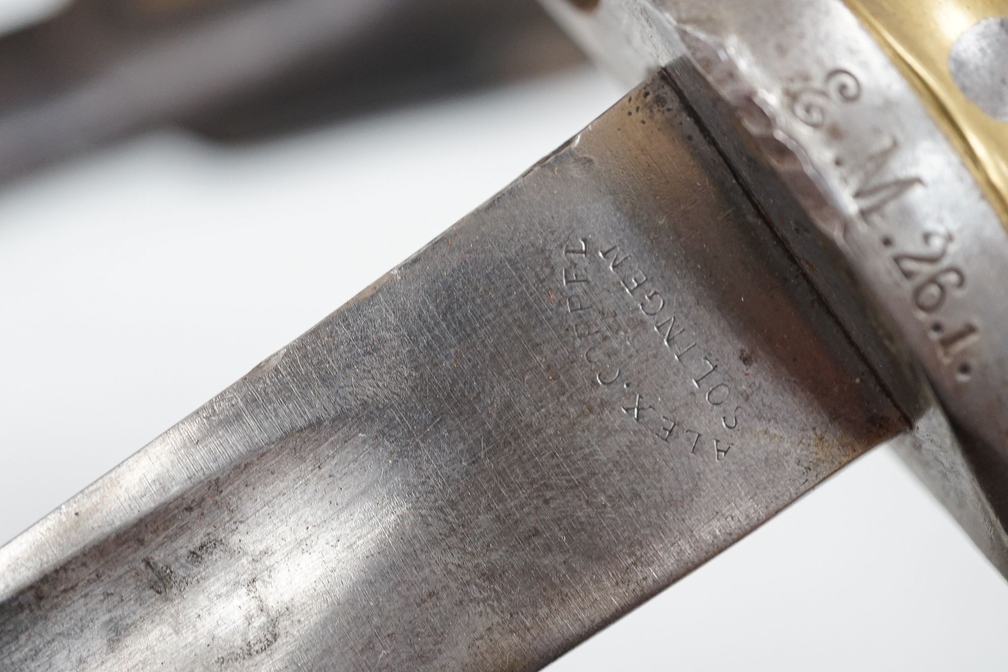 A French bayonet and scabbard with matching serial number (38804) and inscription and date to back of blade (1879) and another Solingen bayonet and scabbard
